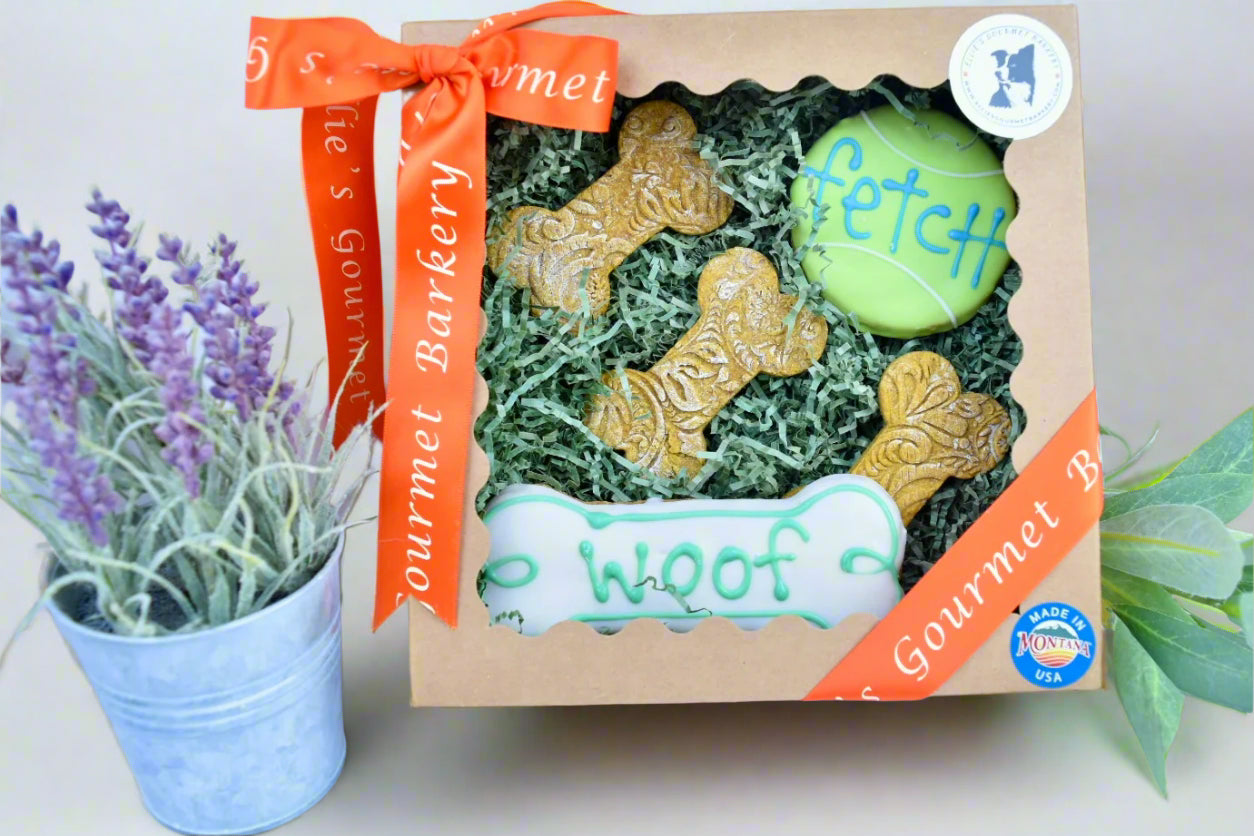 Ellie's Gourmet Barkery seasonal dog treat gift box with custom decorated cookies and orange ribbon - personalized gourmet dog treats made in Montana