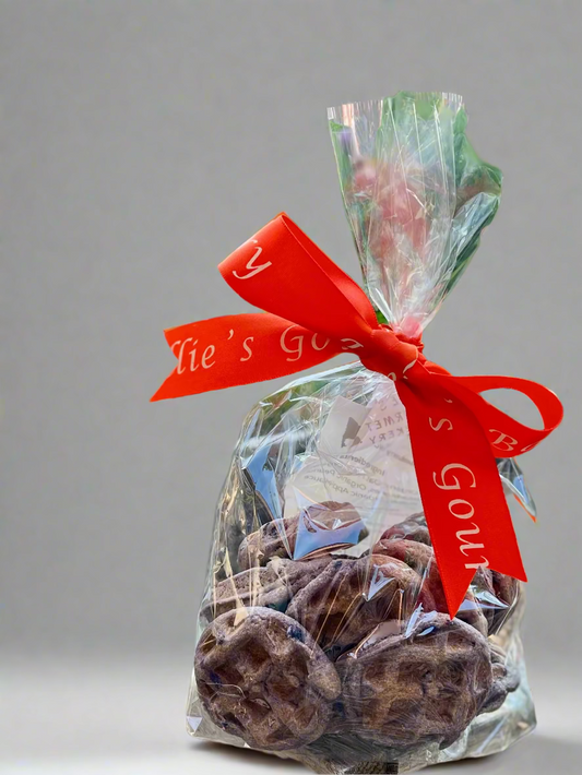 Ellie's Gourmet Barkery Woofles dog treats in clear cello bag with branded orange ribbon - artisan Montana-made dog treats with premium packaging